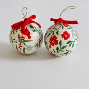 Hand-painted botanical Christmas ornament with red cardinal and greenery